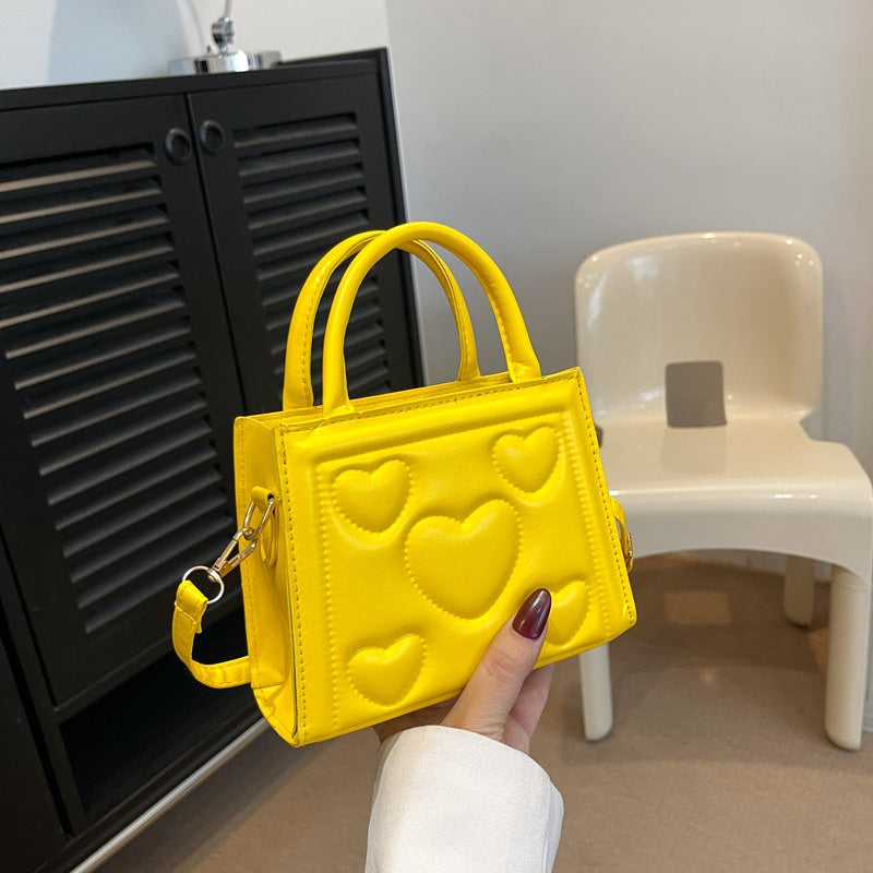 1pc Women’s Stylish Solid Color Handbag with Detachable Strap – Heart Pattern Design, Perfect for Valentine’s Day Gift, Available in Magenta, White, Black, Green, Yellow